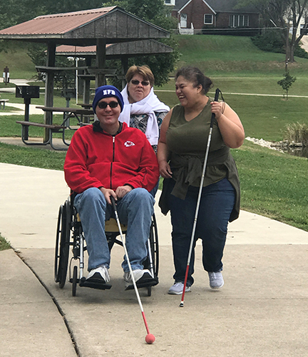 Stephanie, Jeff Griffen, and a friend from Kansas City finish up a walk around McKay Lake.]